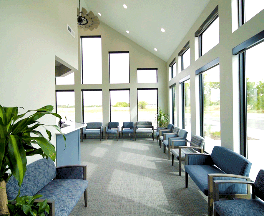 Double-height windows help our waiting room feel light and airy